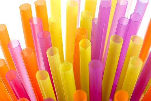 Color vivid drinking straws background on white background.