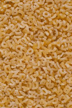 Macro up view of soup spaghetti letters.