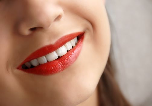 young girl beautiful red lips smiling closeup