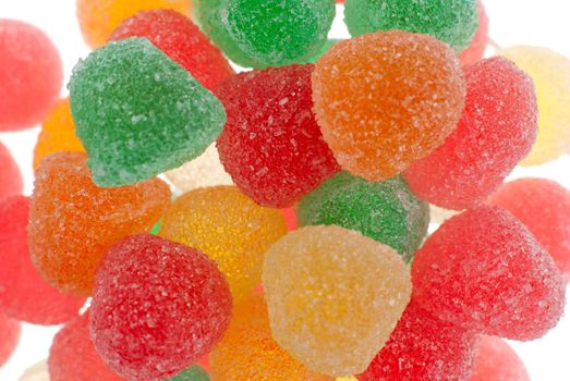 Coloful sweet candies background isolated on white.