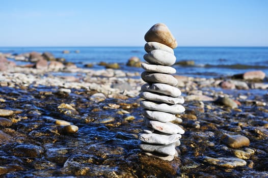 Stack of gravel among the stream on coast