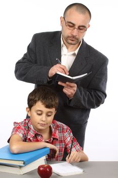 Schoolboy and  teacher in classroom 