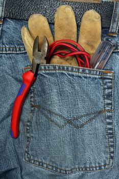 tools in the back pocket of jeans