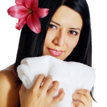 Beautiful young spa woman hugging a white towel.
