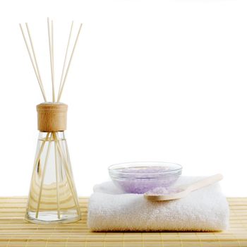 Spa scene on top of a bamboo mat and against a white background.