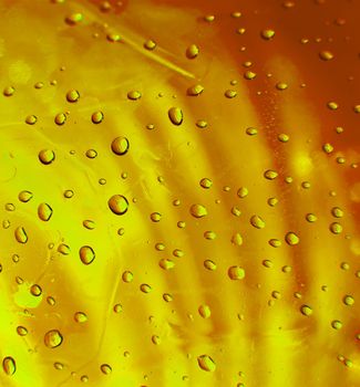 Raindrops on a golden surface