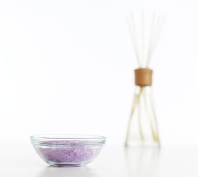 Bath salts on display against white, diffuser in the background.