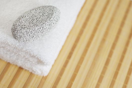 Bath products being displayed on a bamboo mat.