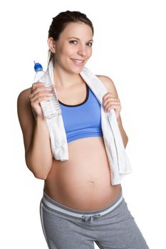 Pregnant fitness woman drinking water