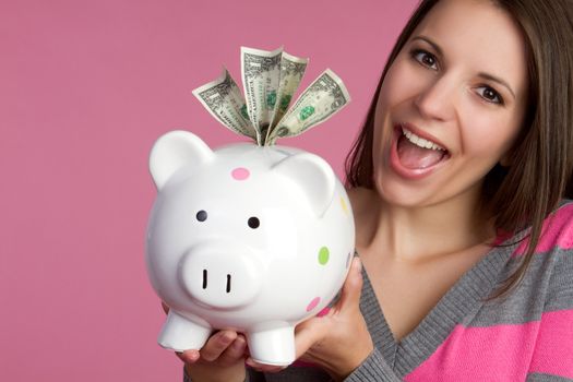 Girl holding piggy bank money