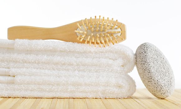 Bath products being displayed on a bamboo mat.