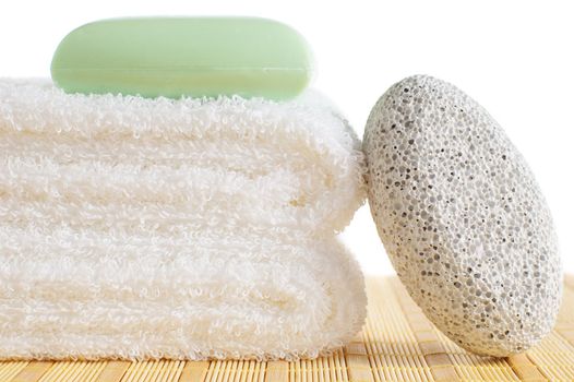 Bath products being displayed on a bamboo mat.