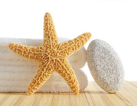 Bath products being displayed on a bamboo mat.