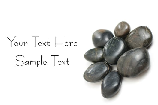 Group of rocks on display on a white background.