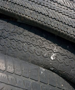 Closeup of the dark texture of used tyres