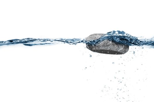 Pumice stone floating in crisp clear water.