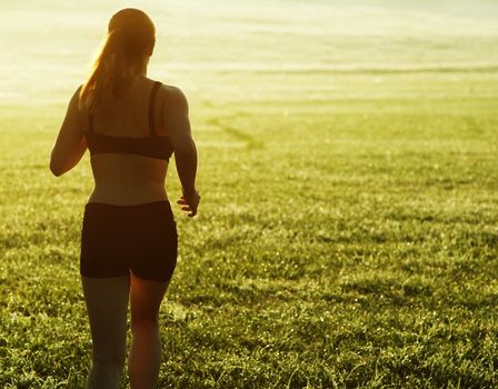 Beautiful young woman runner having a workout session.