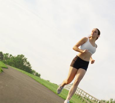 Beautiful young woman runner having a workout session.