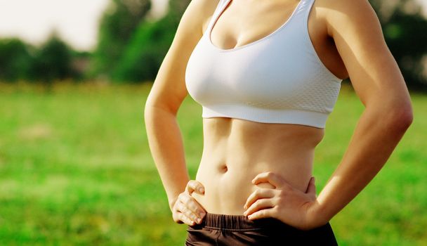 Beautiful young woman runner having a workout session.