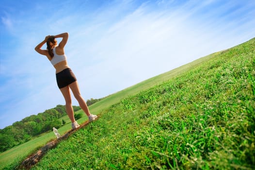 Beautiful young woman runner having a workout session.