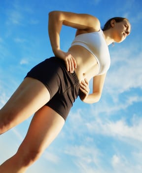 Beautiful young woman runner having a workout session.