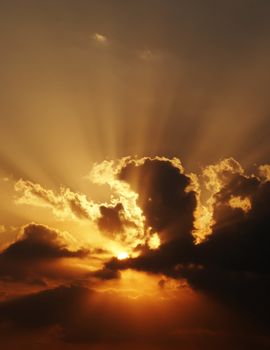 dramatic sundown scene with dark clouds and rays. Good as background, wallpaper.