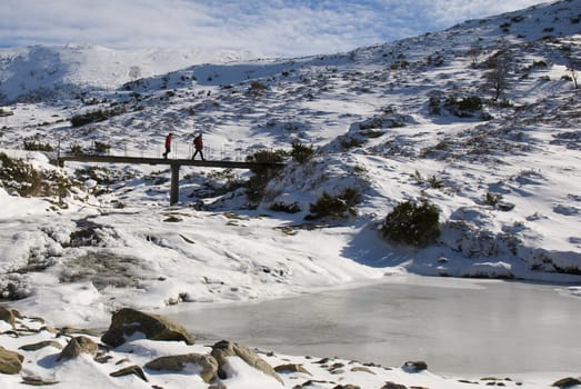 People walking on bridge in winter landscape!