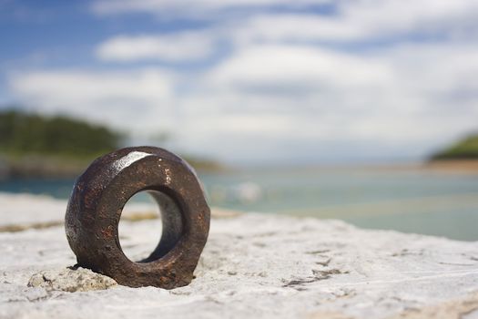 image of a metal rusted ring in a landscape