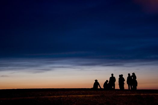 a group of teenagers at the end of the day