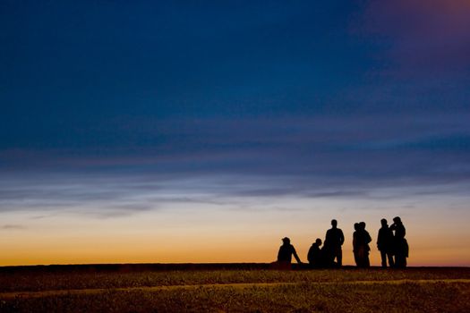 a group of teenagers at the end of the day