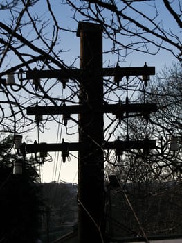 Silhouette of old fashioned telegraph pole


