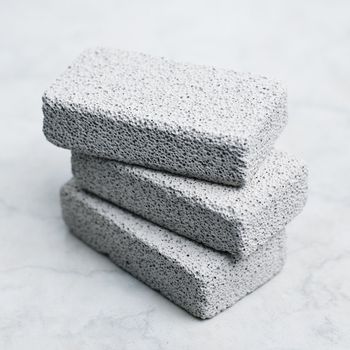 A stack of pumice stones against a white background.
