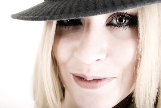 close-up portrait of a young seductive blonde in hat