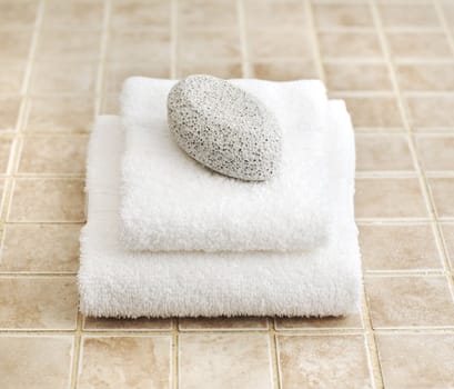 Spa display against a stone tile backdrop.