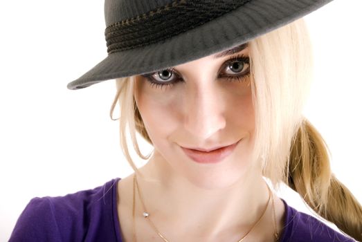 Portrait of a young seductive blonde in hat