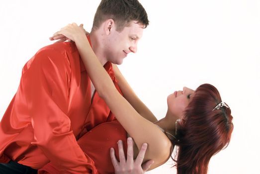 Young couple in red as a concept of love and passion