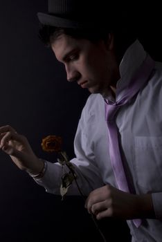  young man with a rose as a concept of romance 