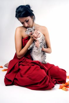 young beautiful brunette taking care of the cat