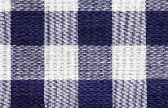 some blue and white checkered fabric forming a background pattern