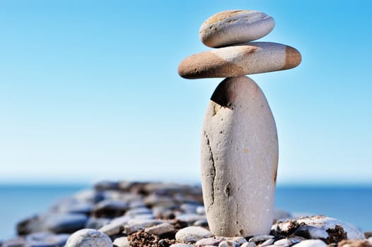 Two stones balancing on top of cobblestone