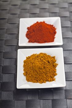 curry and paprika powder on small plates