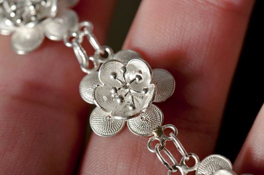 Luxury jewelry bracelet in silver rappresenting a loto flower