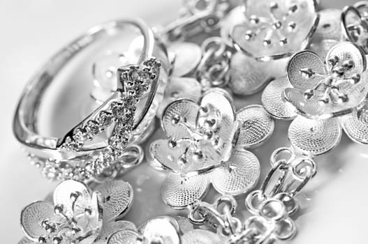 White gold jewelry ring and bracelet in white background