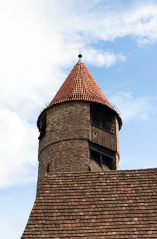 This image shows a old tower with sky and clouds