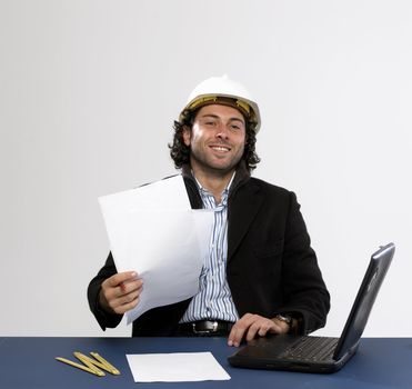 Young architect at work with laptop