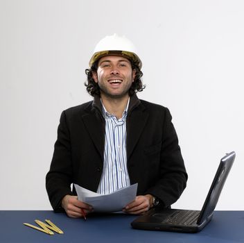 Young architect at work with laptop