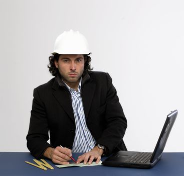 Young architect at work Writing a check