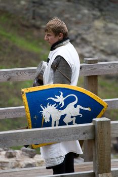 CESIS, LATVIA, June 7, 2009: Knight before swordfight on wooden bridge during the medieval festival "Livonia. 1378. Wenden". Rainy day.