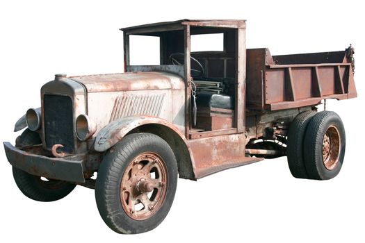 This is an old 1920s dump truck tipper in great disrepair, isolated on a white background.
