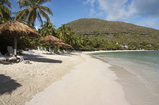 A view of a peaceful island beach resort.